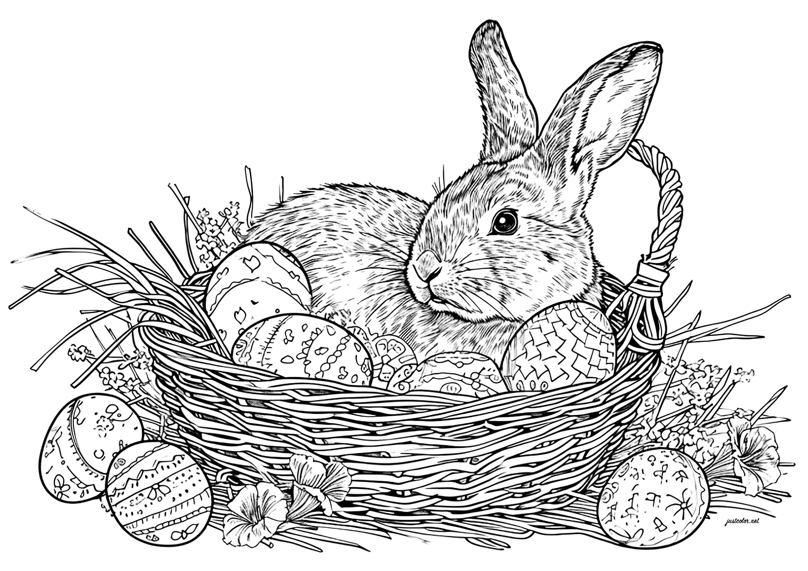 Conejo de Pascua y huevos en una cesta de mimbre