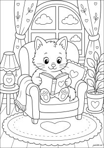 子猫が大きなふわふわの肘掛け椅子で本を読んでいる