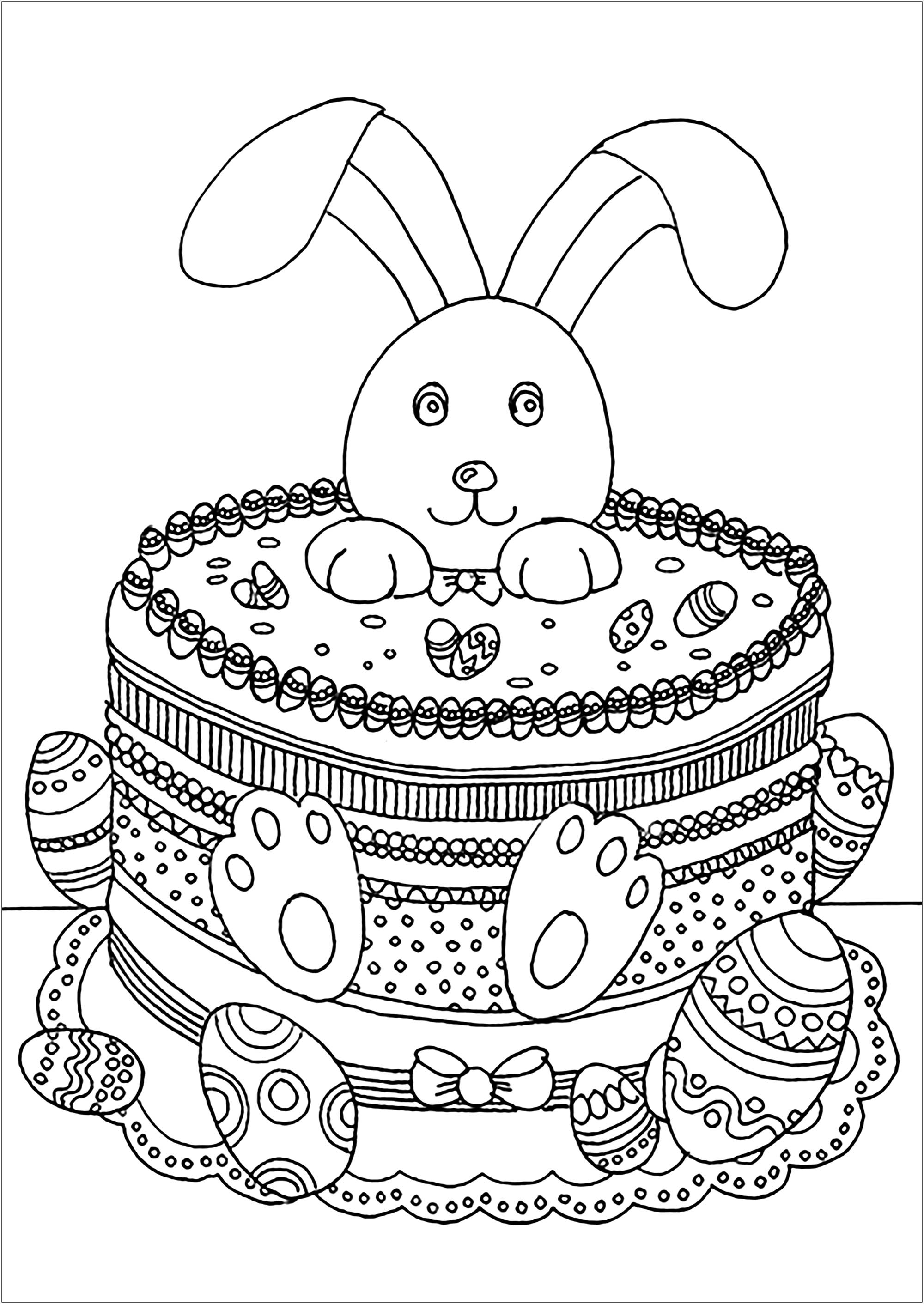 Coelho da Páscoa engraçado num bolo, com ovos para colorir