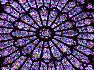 Stained glass windows, rosette of the north transept, Cathedral of Notre-Dame de Paris, France.