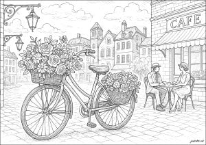 A romantic escape down a cobblestone street. Bicycle adorned with flowers parked next to a café. A couple chatting at a terrace table in a picturesque town. A romantic escape down a cobblestone street